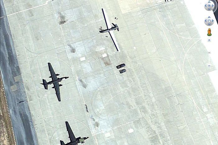 In the open: Global Hawk drone A Global Hawk drone and two U2 manned spy planes on the tarmac at Beale Air Force Base in California.